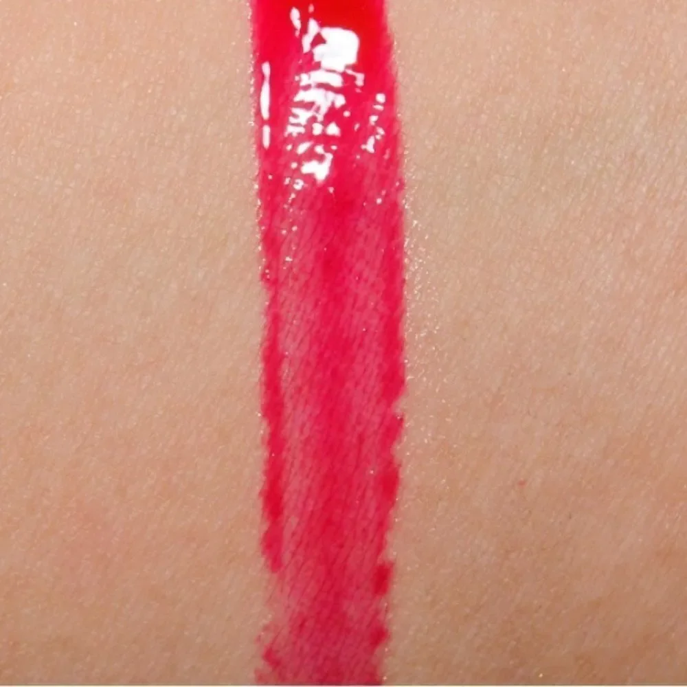 NIB MAC Archie’s Girls Lipglass in “Strawberry Malt”